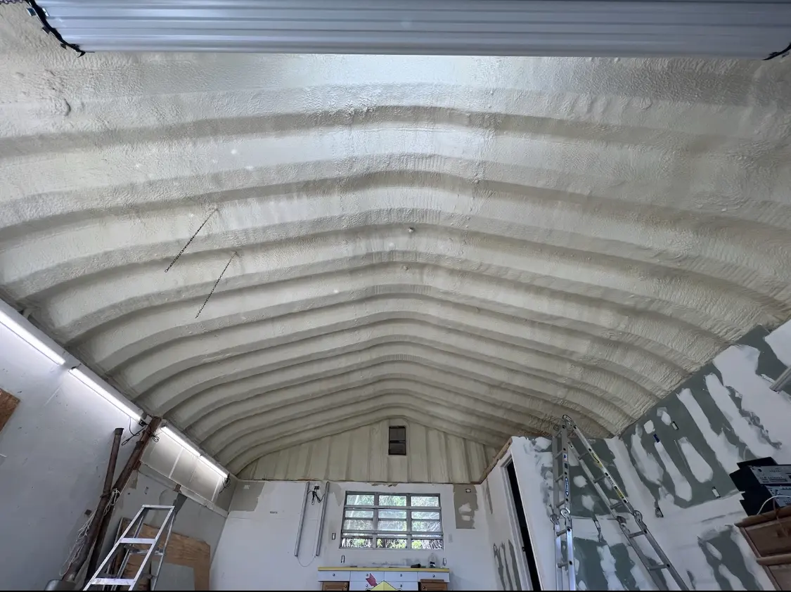 Spray polyurethane foam applied to the underside of a metal roof deck in Naugatuck